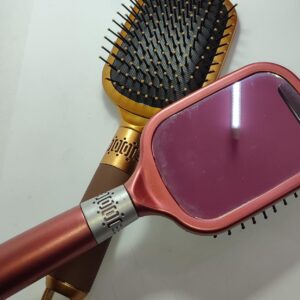 Peine color dorado para desenredar cabello con espejo